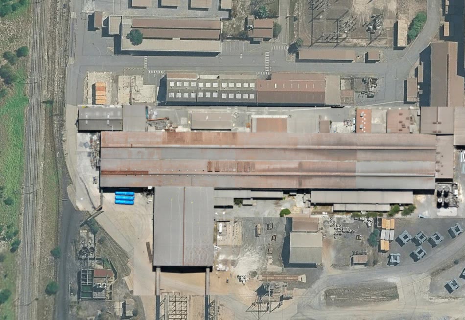Detail of an industrial plant and rail corridor from above